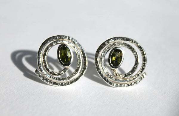 Hammered spiral silver studs with peridot gemstones