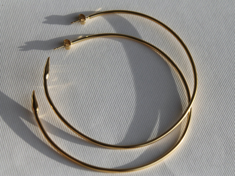 Large 75mm diameter solid gold-plated  silver hoops with sculpted arrows at the ends