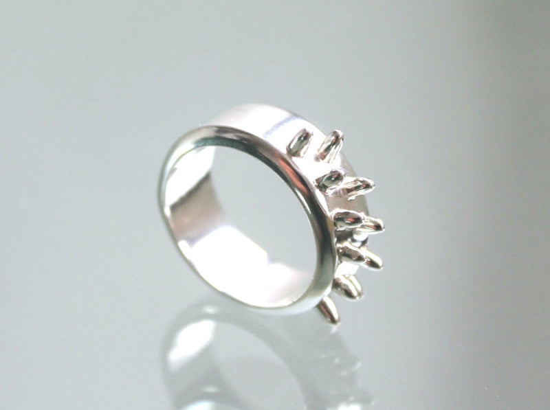 Men's Silver wide ring with bevelled edges and  bullet shaped spikes