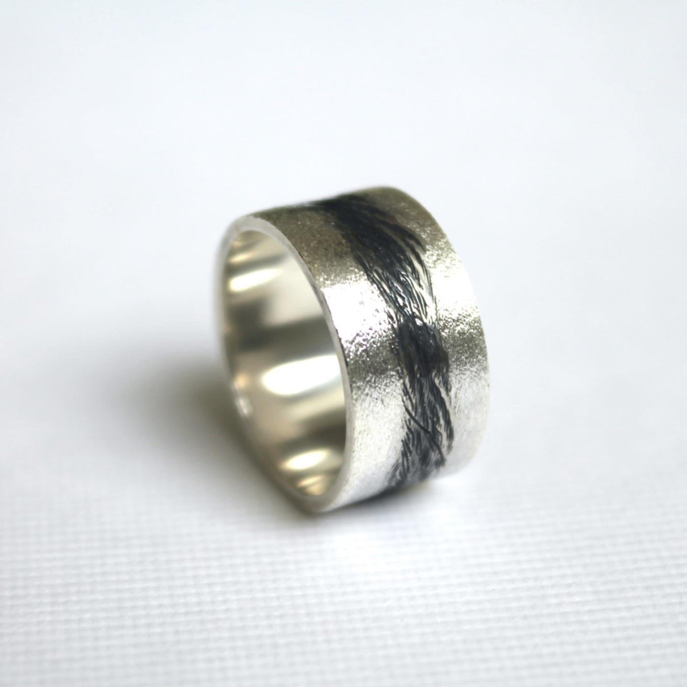 Sandblast textured silver  band with black river running through