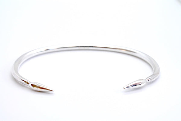 Silver open arrowhead  bangle, heavyweight  and solid with arrows at the ends