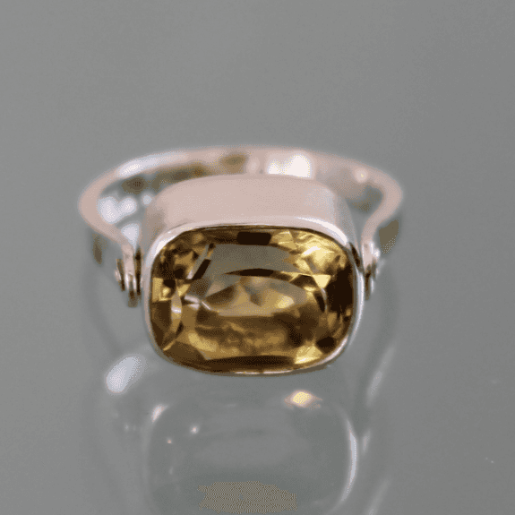 A large lemon quartz gemstone swivel ring in silver.  An ancient style done differently .