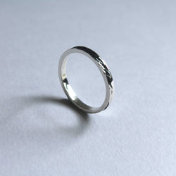 silver 3mm artisanal band with black river imprinted
